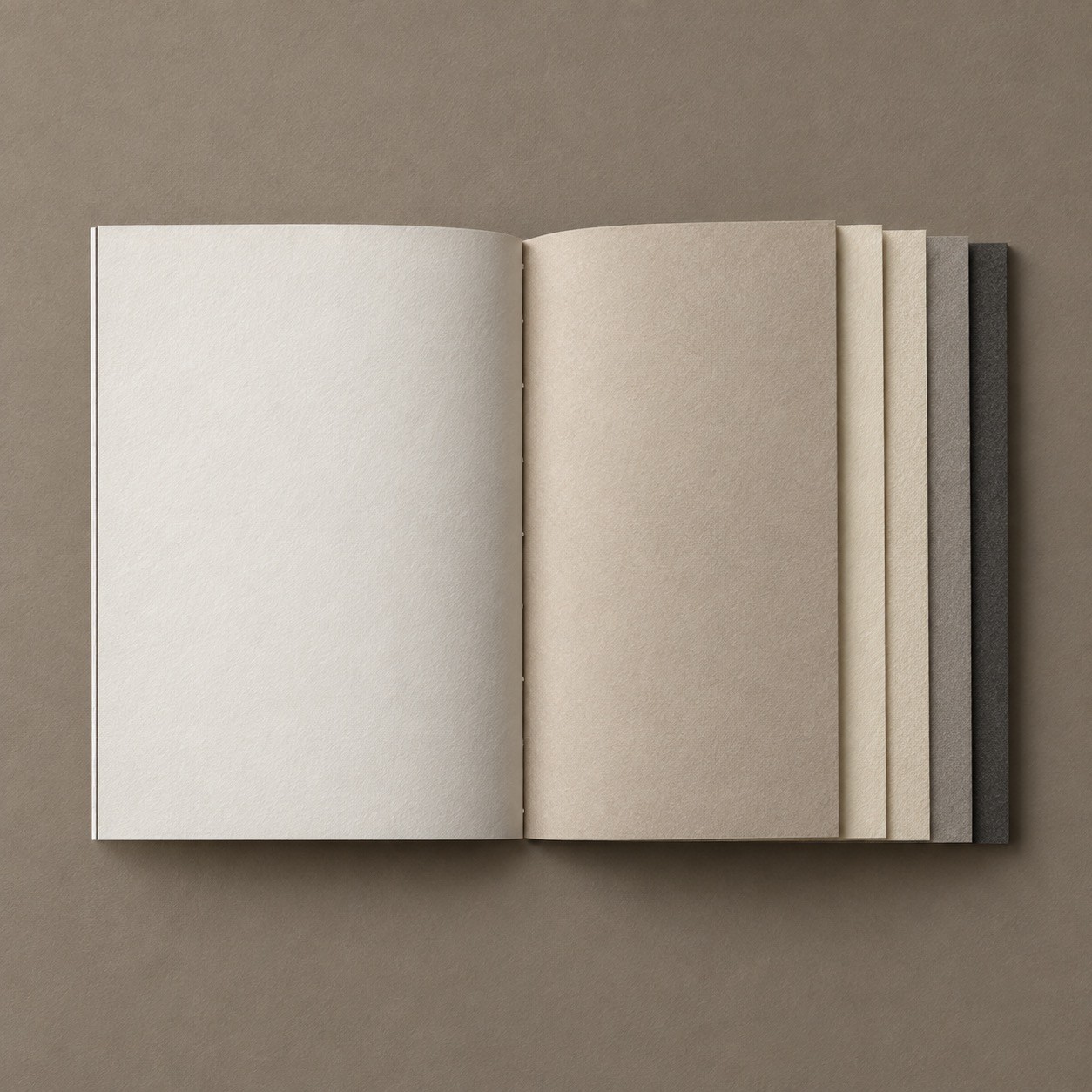 Open catalogue printed across five paper stocks
