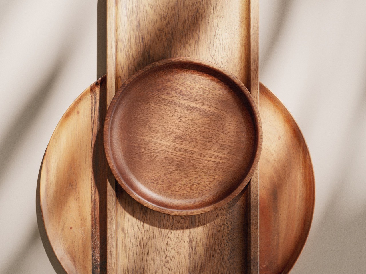 Person balancing on rocks by the ocean at sunset