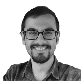 man standing beside wall