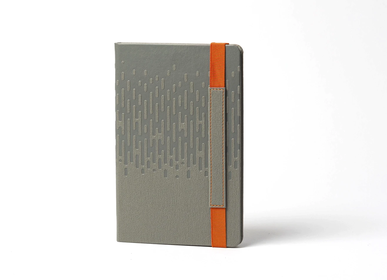 Front view of standing grey notebook with cascading embossed pattern.