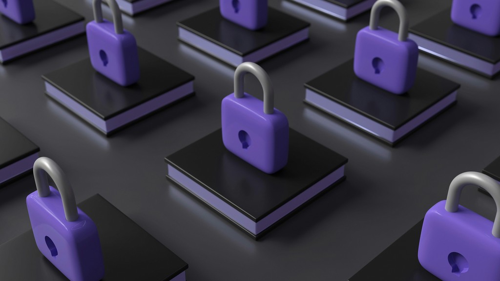 A series of black books each topped with a purple padlock, arranged in a grid pattern on a dark surface, symbolizing data security, information protection, and privacy.