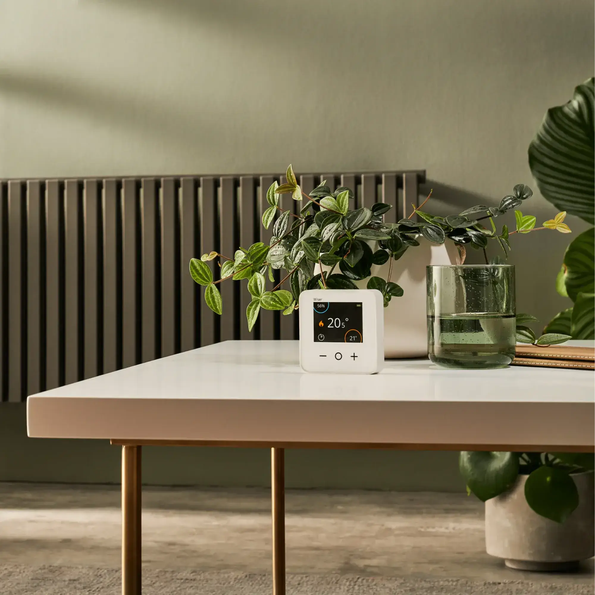 a group of people standing around a table with food