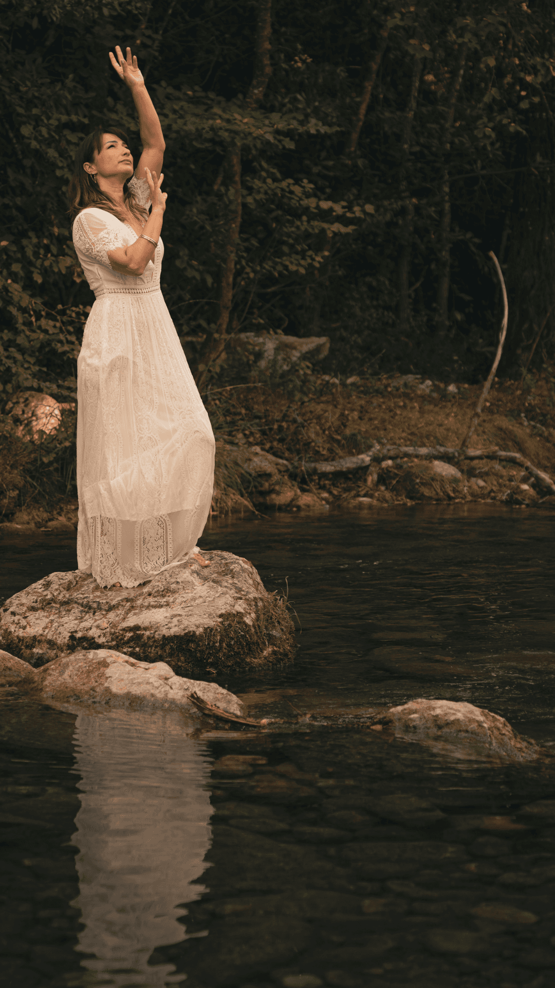 Marjorie in the middle of a river - talking to the sky