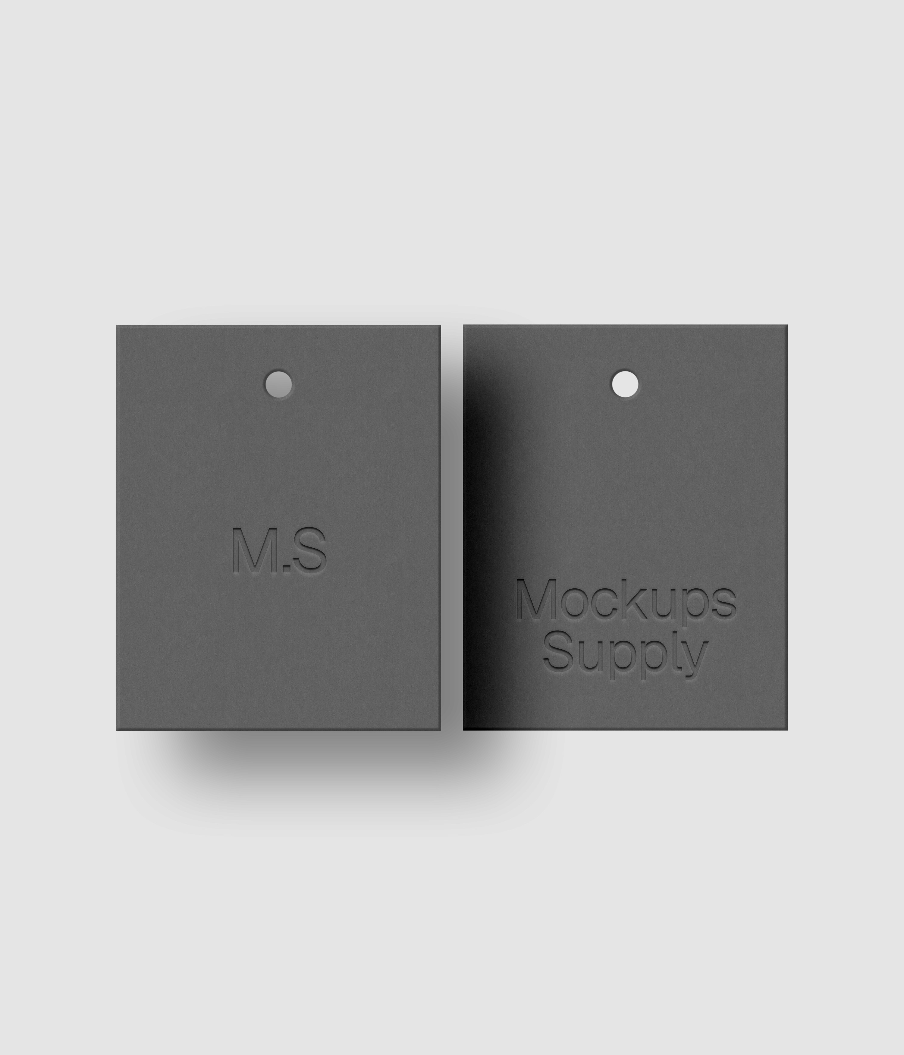 Two gray 4x5 retail hang tags mockup on white background with natural shadow depth and debossed logo effect for Photoshop download psd