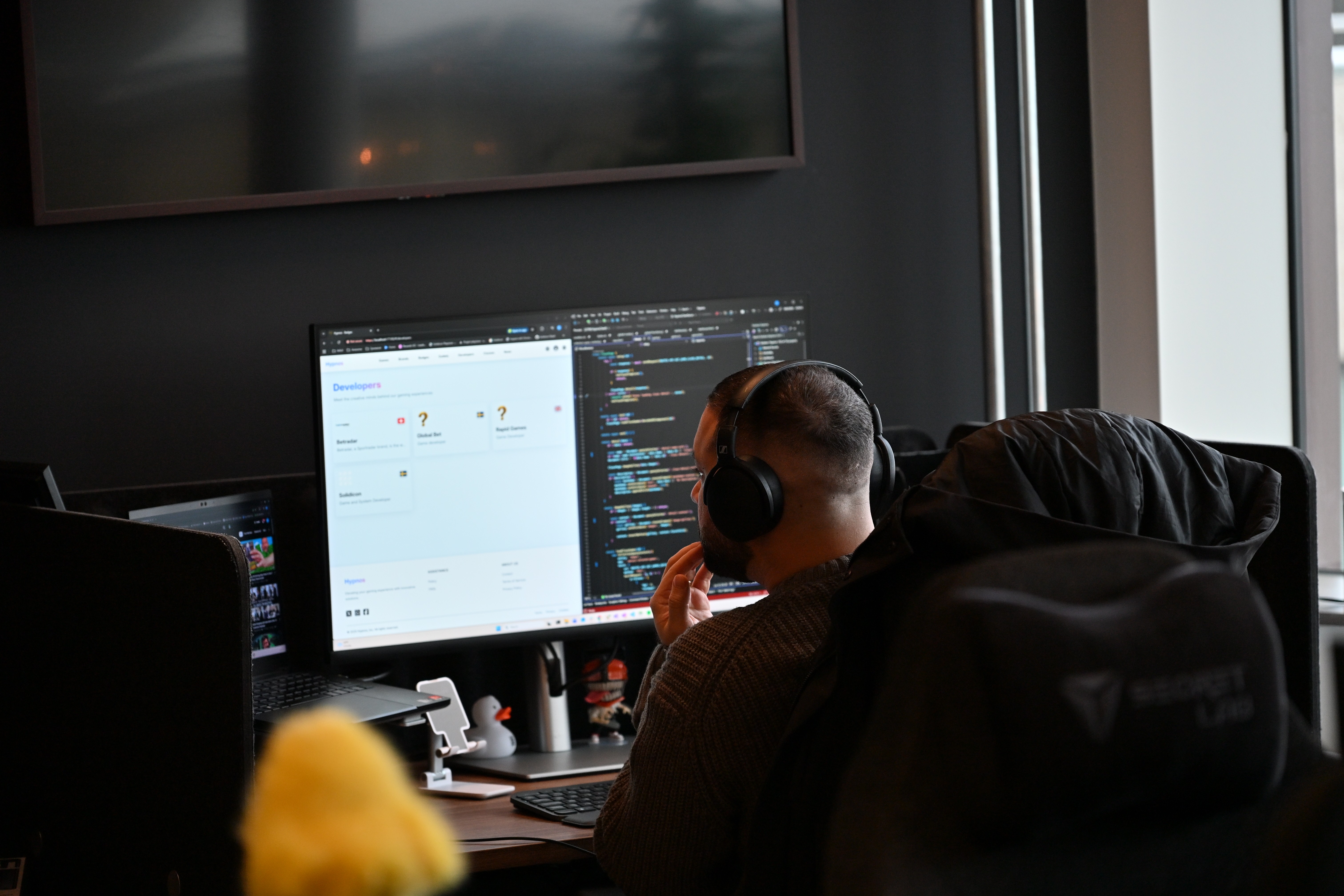 a person sitting on a couch with a laptop