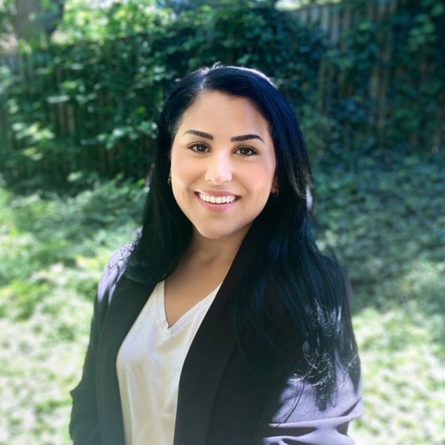 woman in white button up shirt smiling