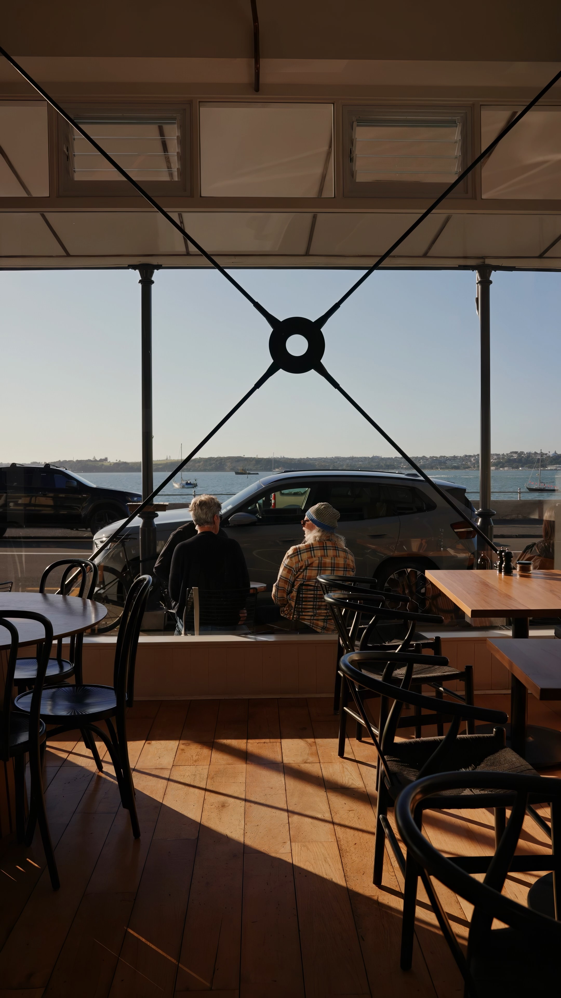 Streetside billboard with flyposters of the Batch.Works brand and illustrations