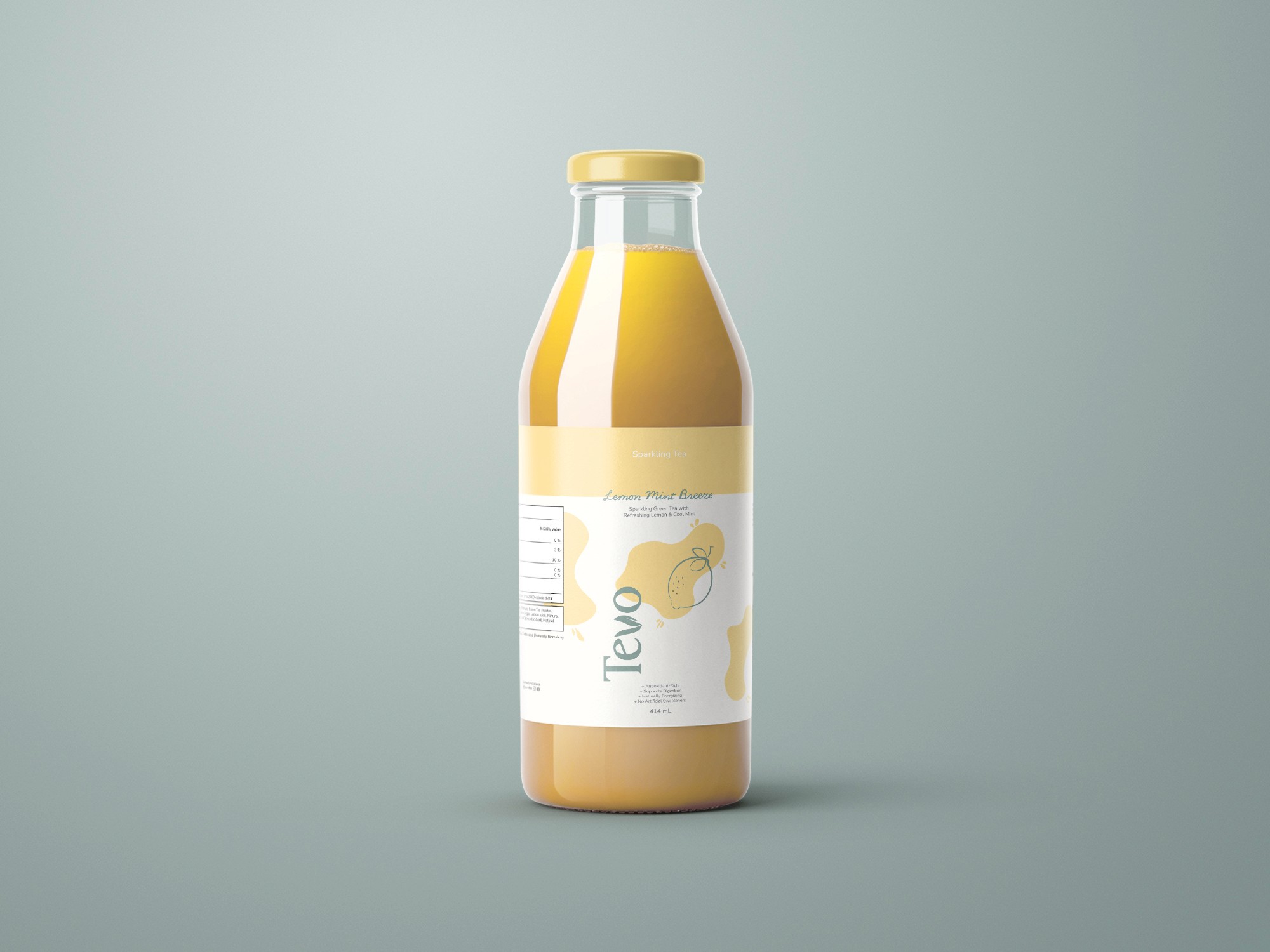 Bottle of Tevo lemon mint essence with a golden cap and light yellow liquid.