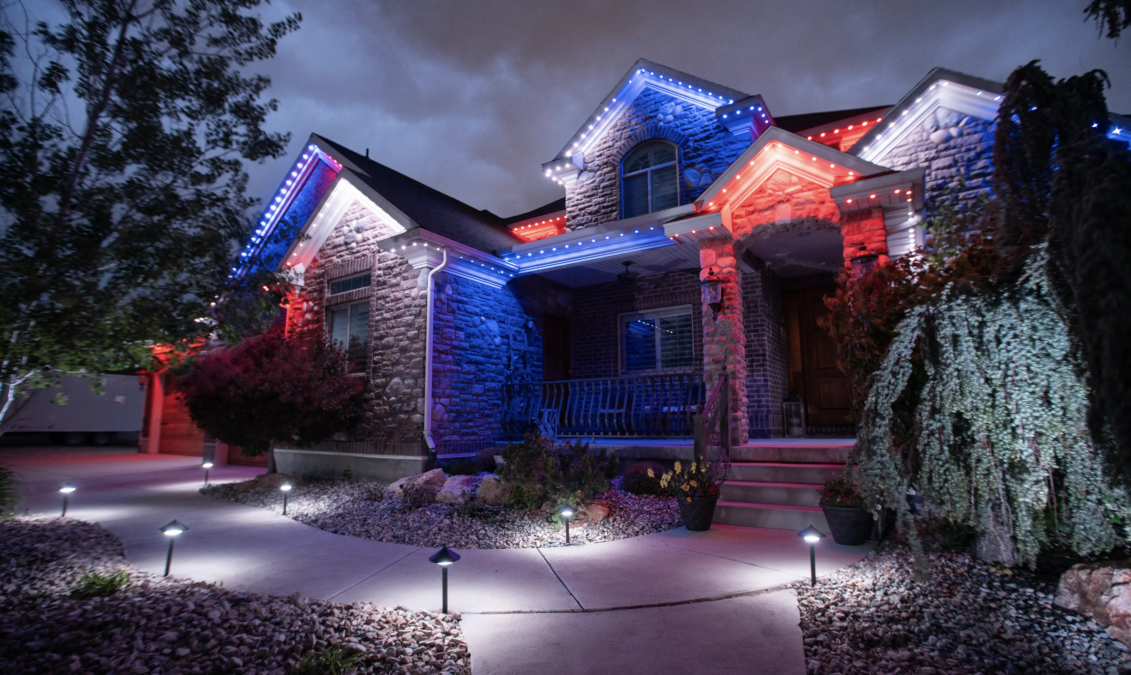 Home with red white blue 4th of July permanent LED roofline