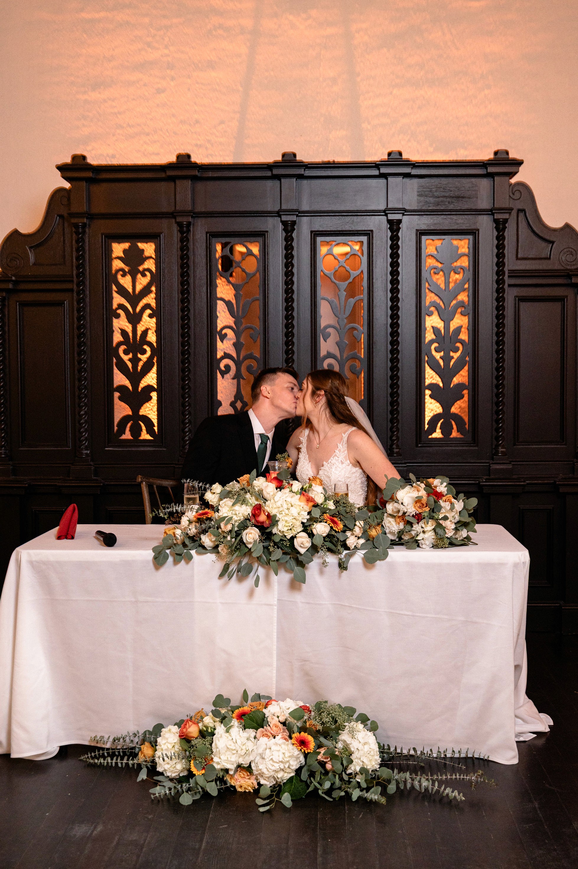 Flat lay wedding details with bouquet, rings, and sparkling bridal heels