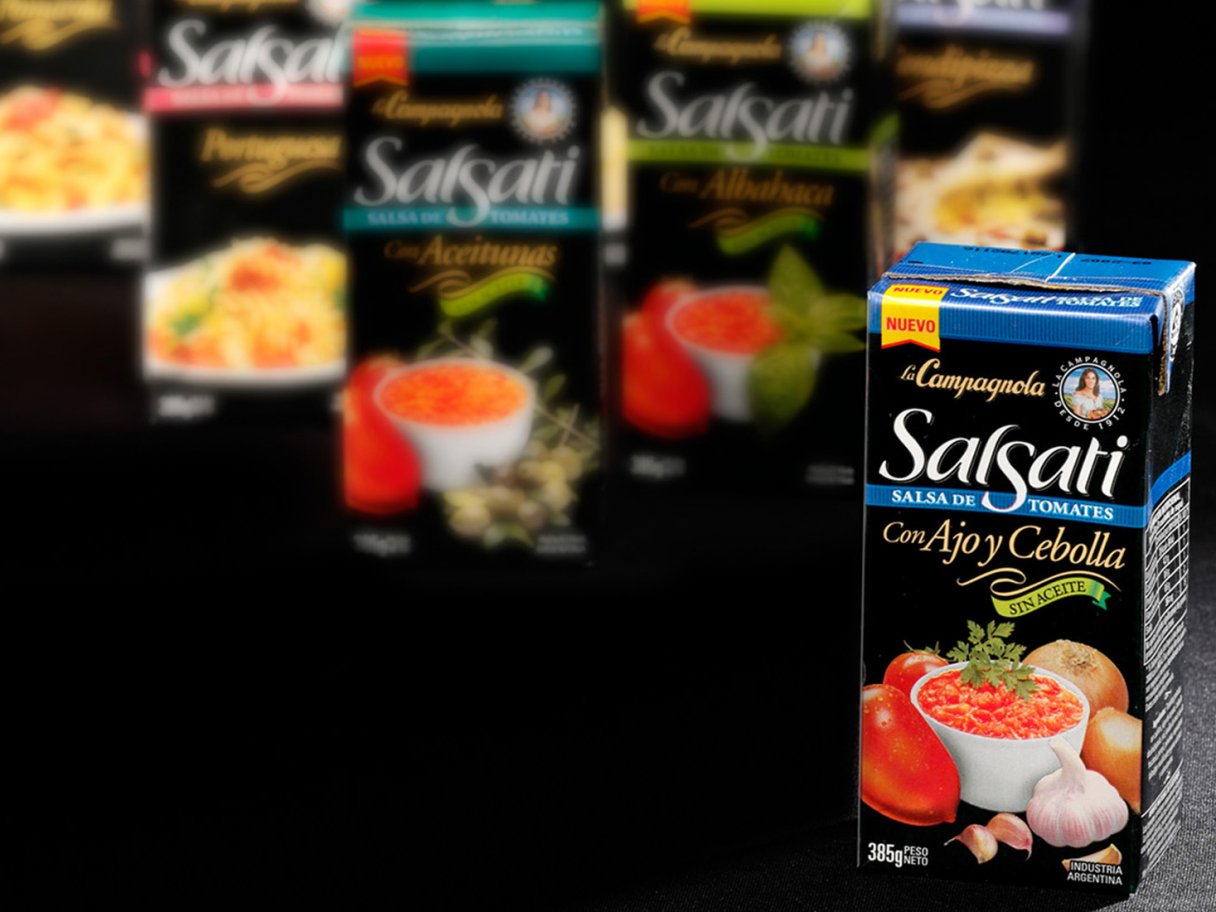 Rooftops of a coastal town with the sea in background