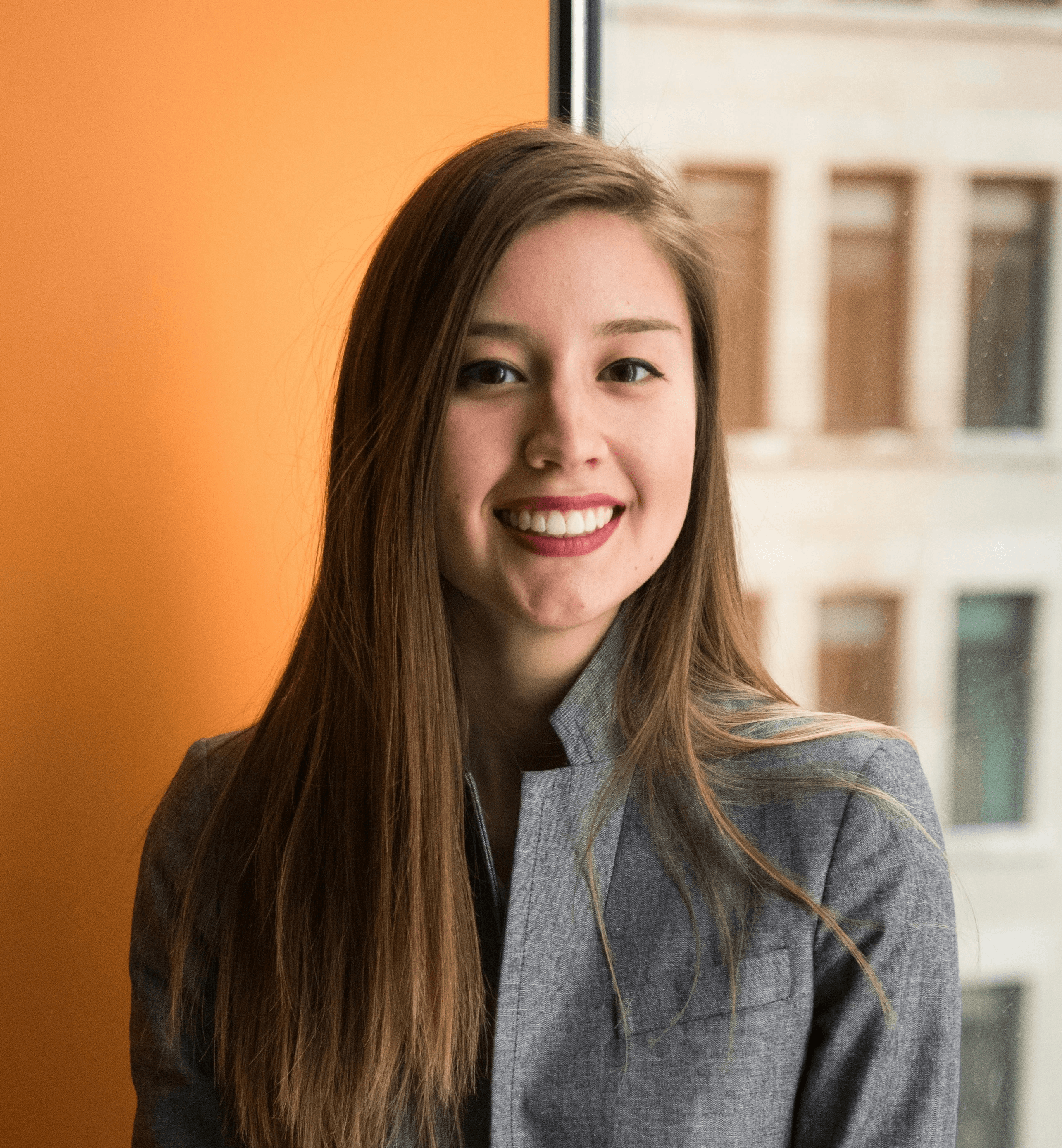 shallow focus photo of woman in gray jacket