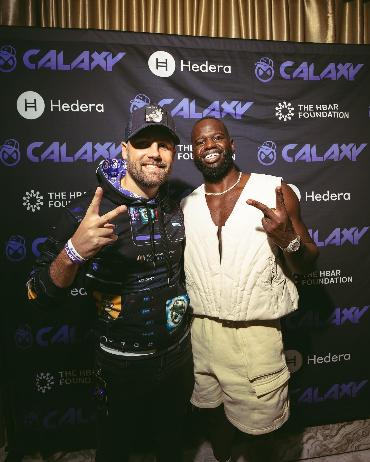 Designer Chadd Weston posing with Calaxy co-founder & CEO, Solo Ceesay at a Twitchcon afterparty in Las Vegas