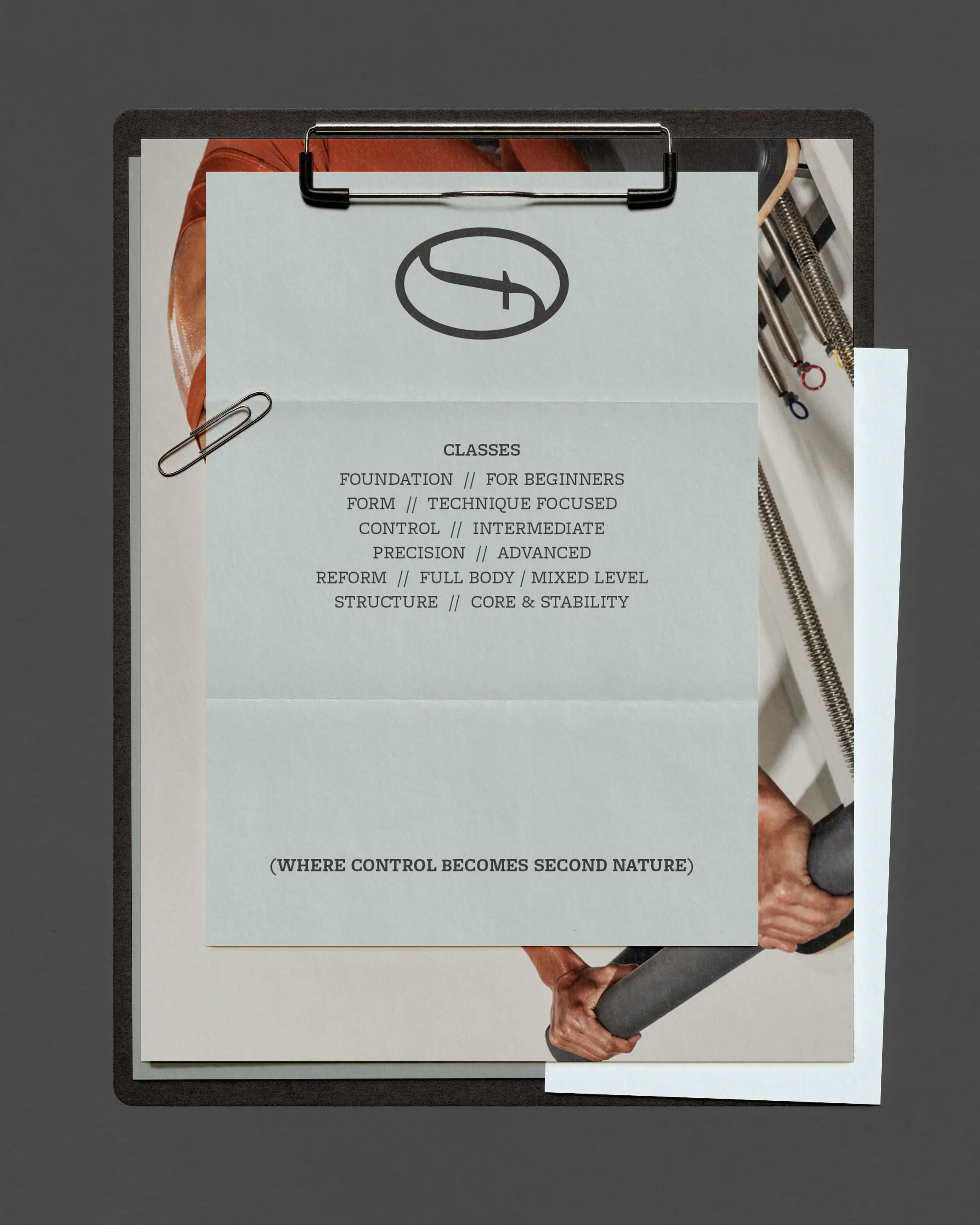 eformr Pilates Studio brand identity — printed class schedule on clipboard