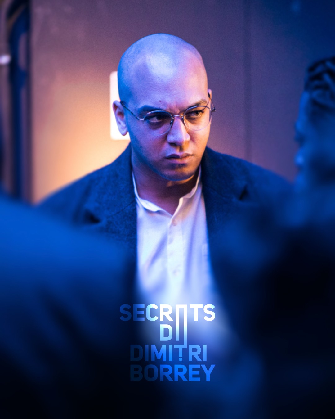 Modern home office setup with a monitor, ergonomic chair, keyboard, and indoor plants near a window with blinds.