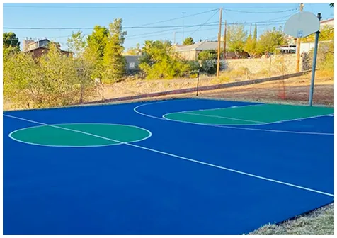 Blue and green multi-purpose outdoor court with clear white line markings for basketball and pickleball