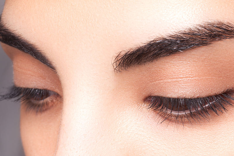 A man's back with water drops on it