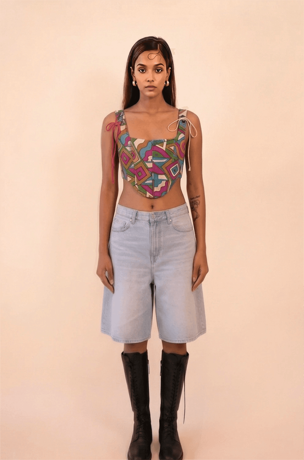 DHARA is our one-of-a-kind printed silk corset with delicate shoulder straps, handcrafted by skilled artisans in-house using a vintage silk saree. The