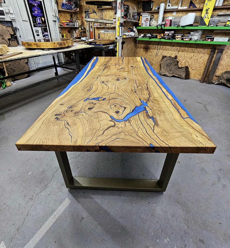 a wooden table topped with glasses and candles