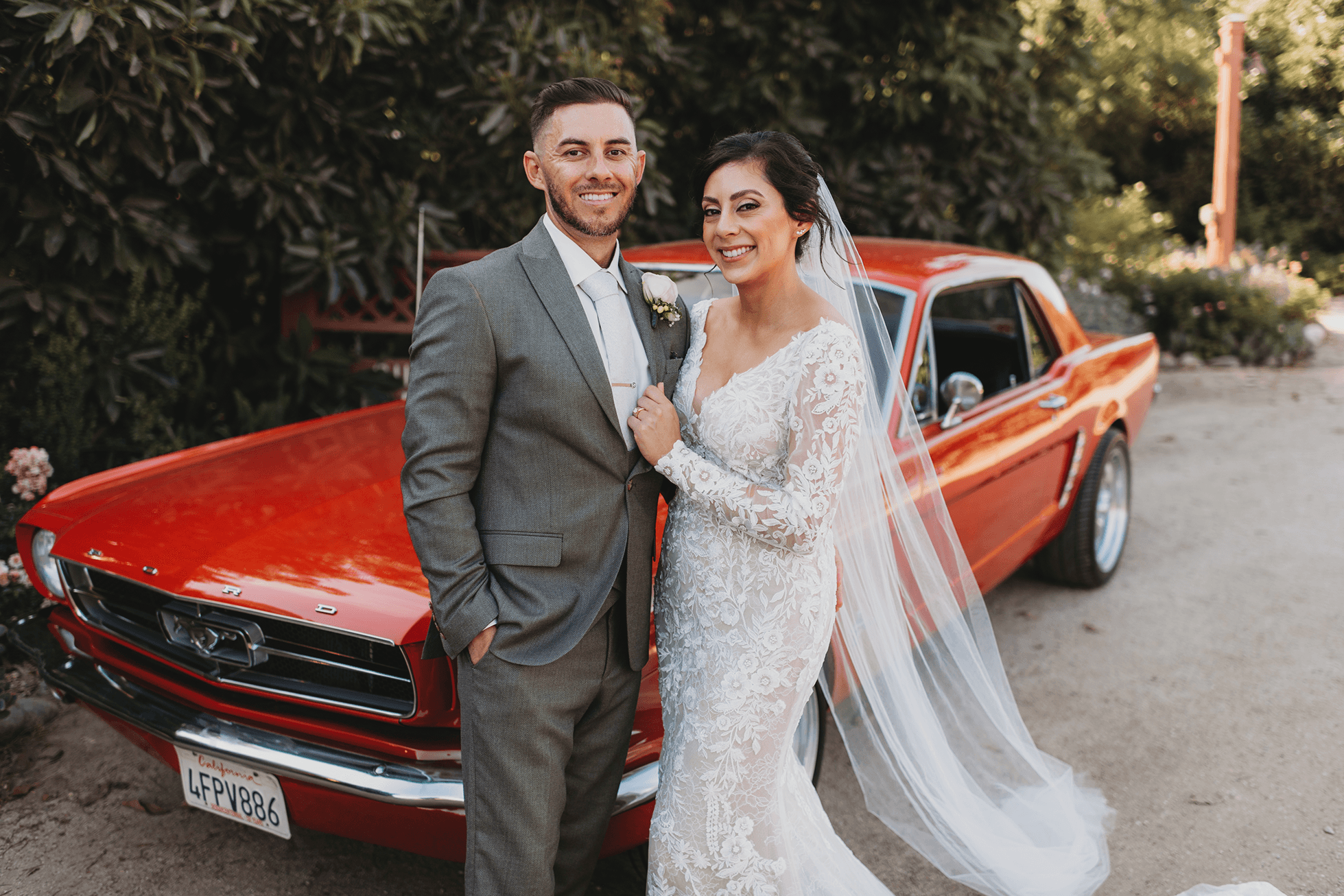 Bride and groom portraits with red Mustang at Gerry Ranch