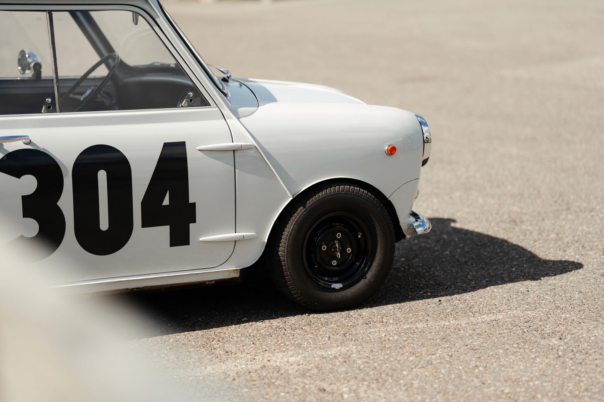 White classic Mini Cooper race car with number 304 build at brooks motors