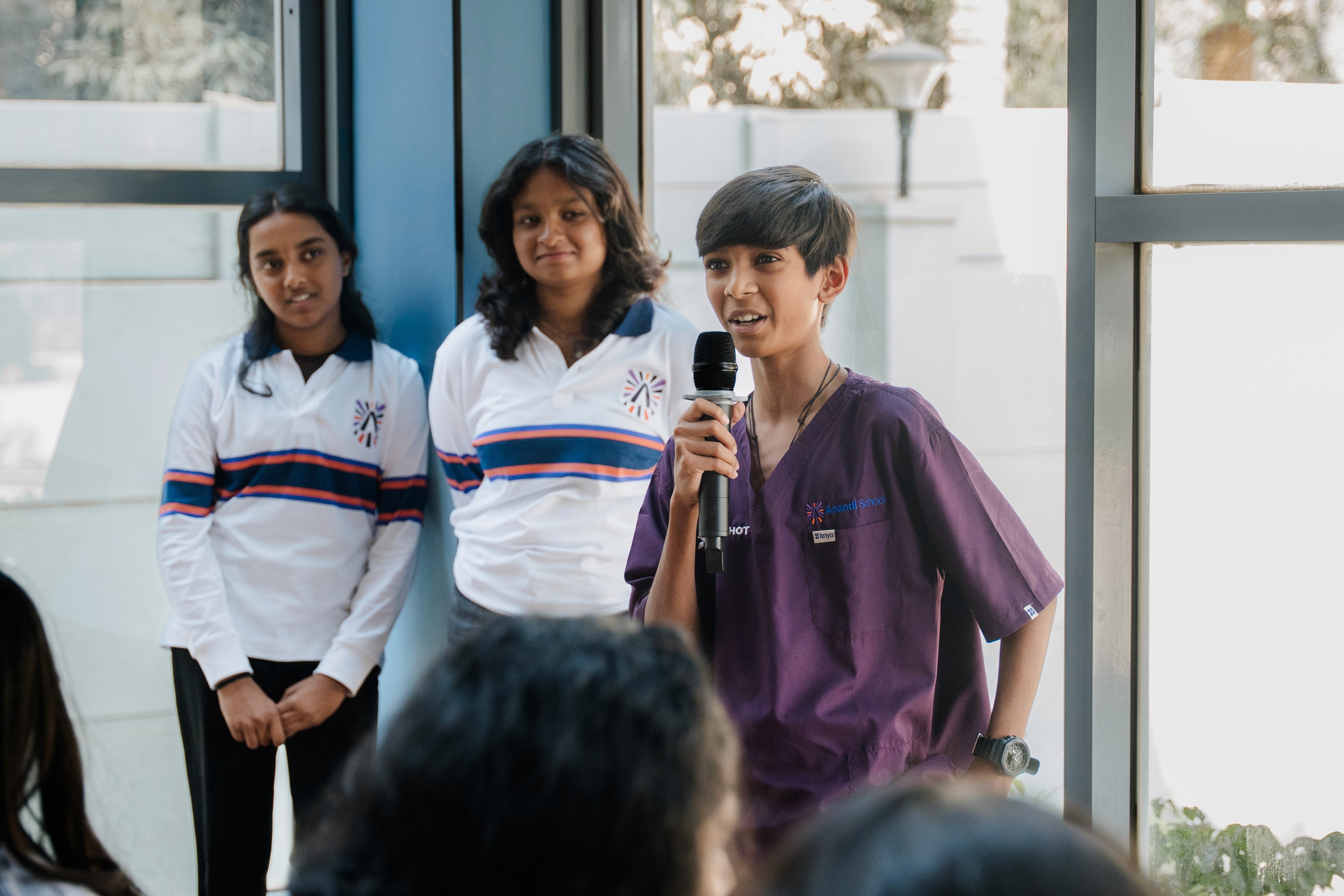 Young students build molecule models, enhancing critical thinking.