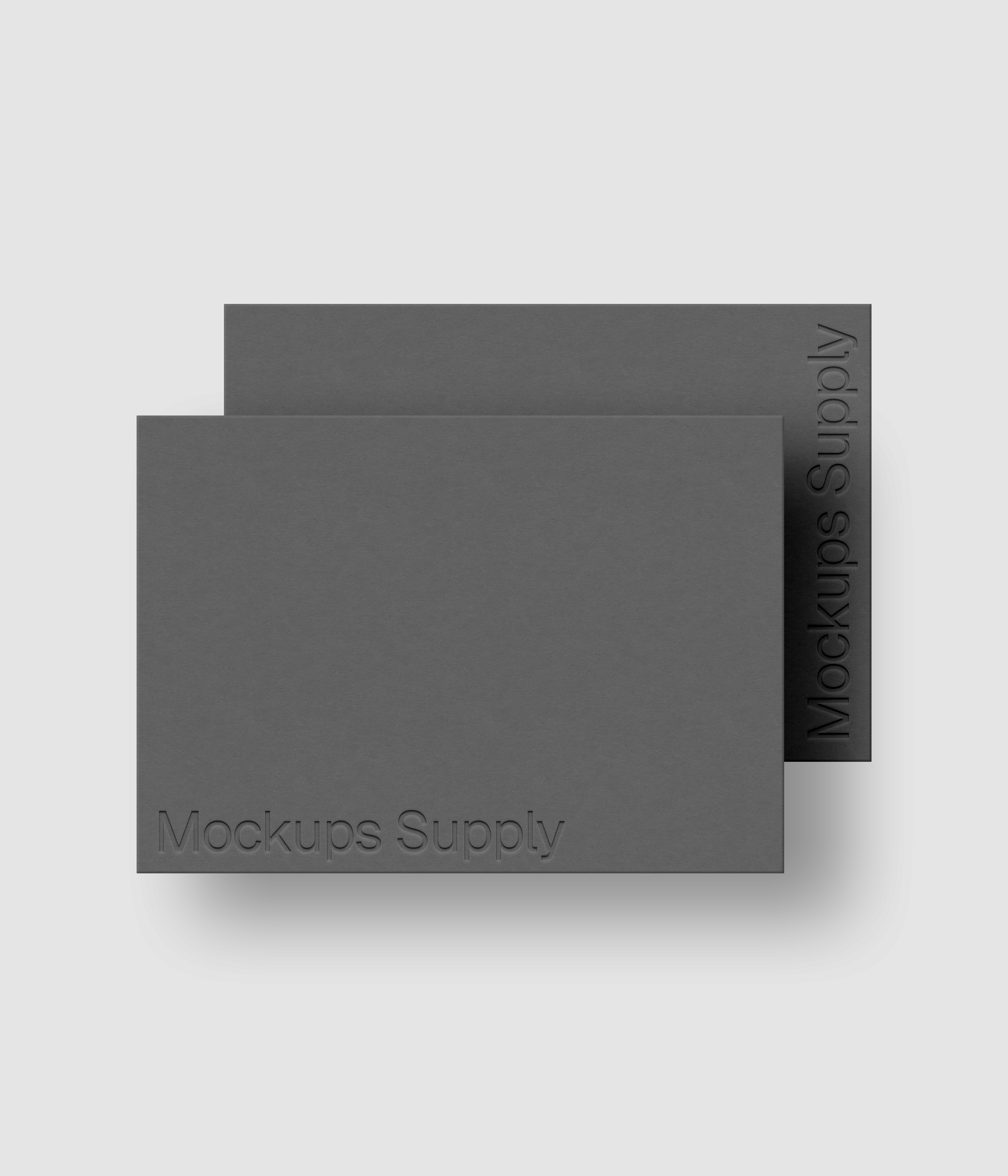 Two A4 paper mockup PSD landscape with debossed logo effect, gray papers on white background, modern minimal stationery mockup for print and brand identity