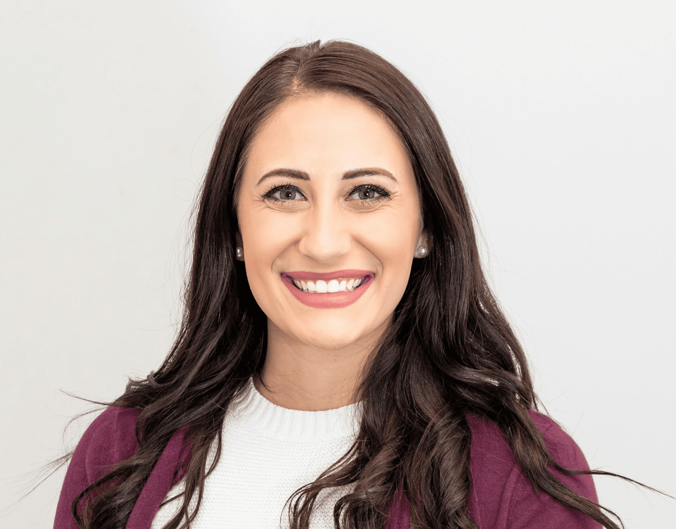 woman in red cardigan smiling