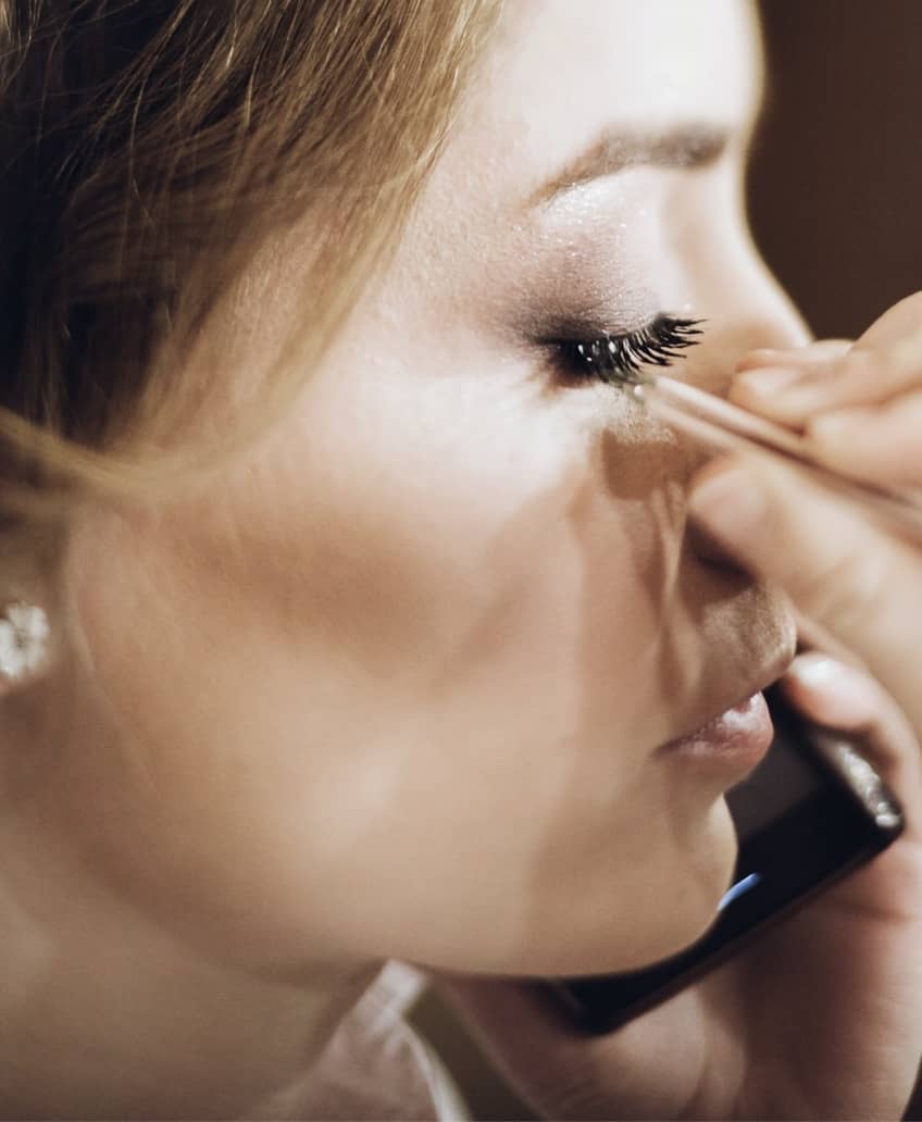girl getting makeup done