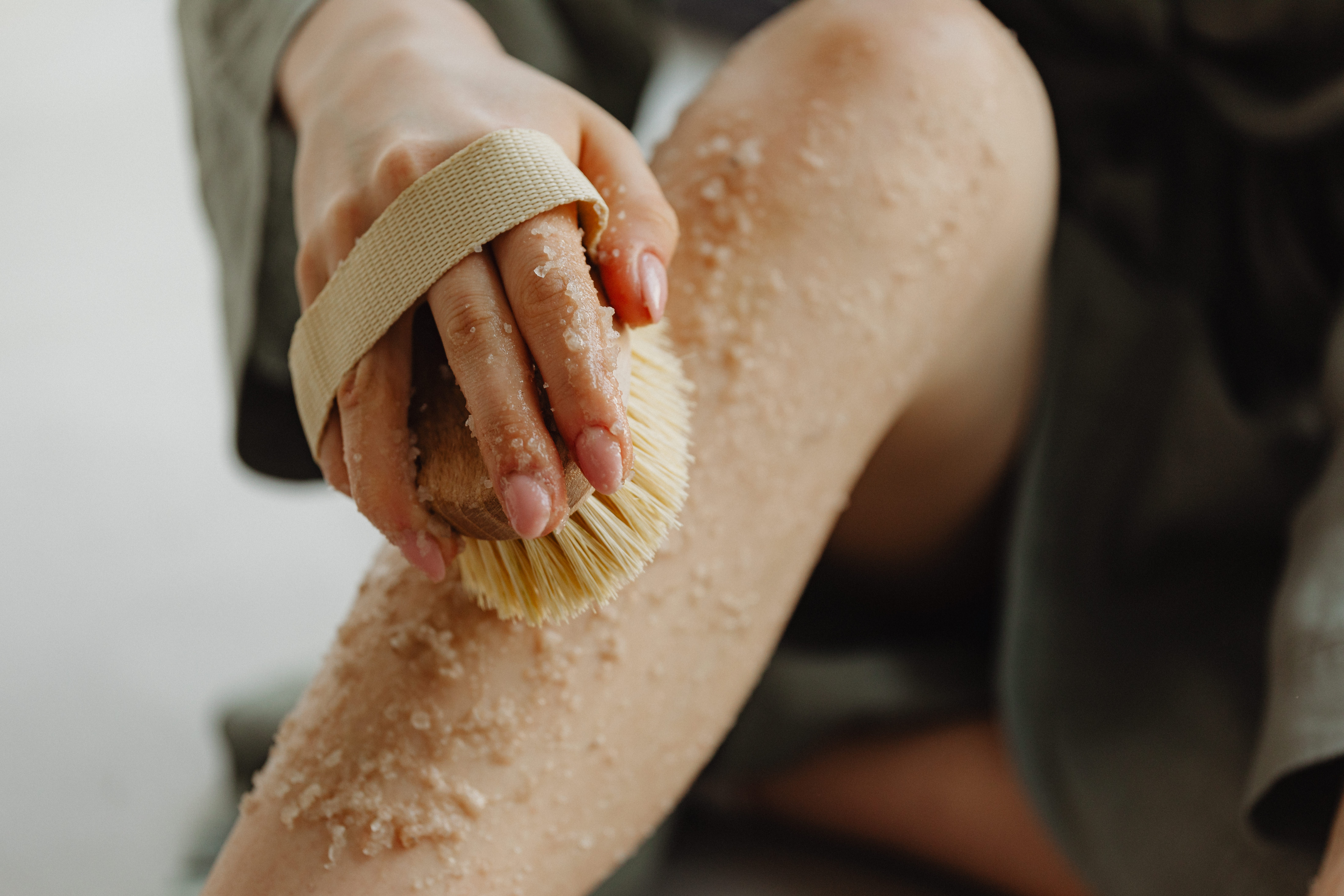 Woman scrubbing legs