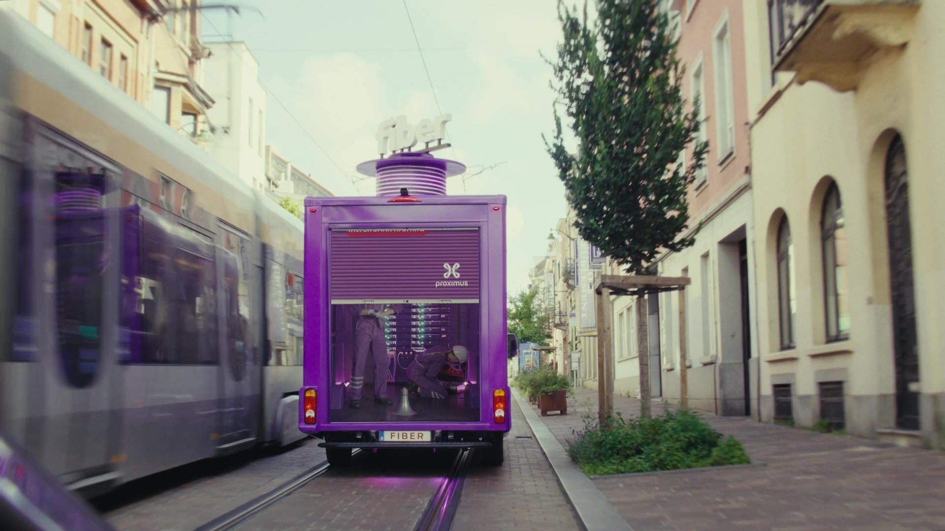 truck driving around the city opening the back to reveal the campaign video