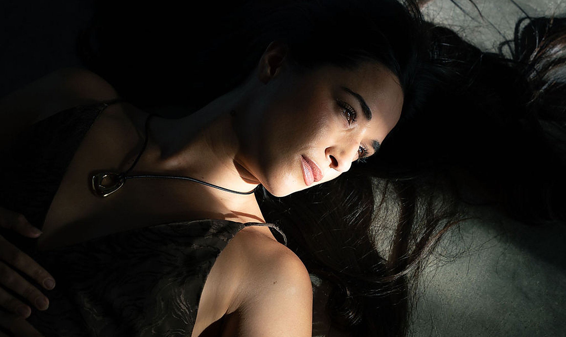 Woman resting in soft light as her nervous system settles, easing stress and low libido | My Temple
