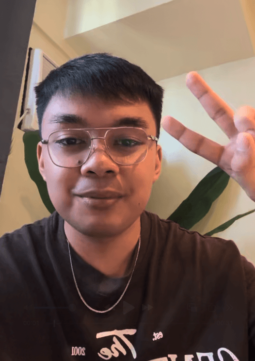 man standing beside wall