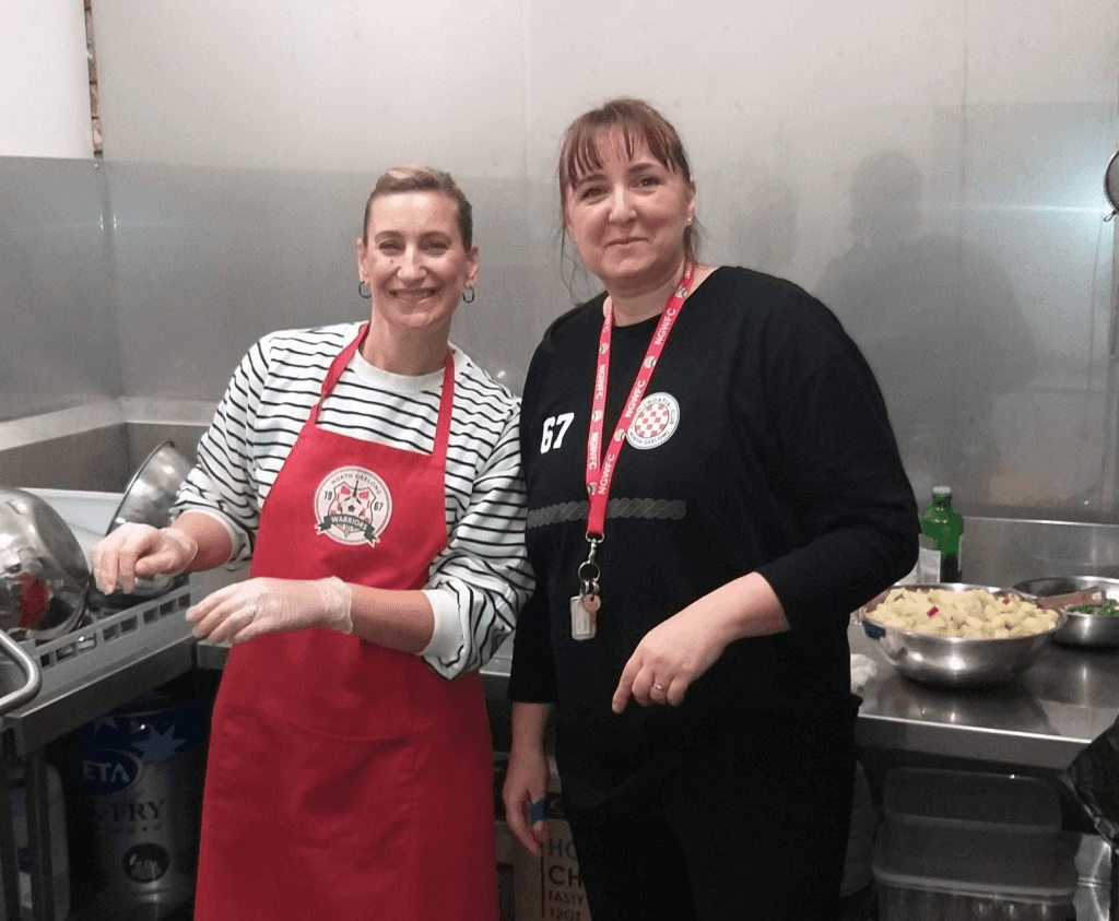 Club volunteers assisting at the North Geelong Warriors canteen on matchday.