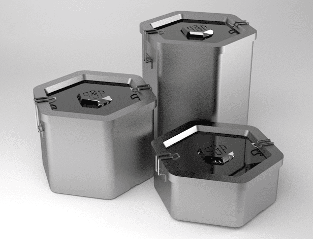 Three gray metal containers with black lids are arranged on a light gray surface. The containers have hexagonal shapes and feature small hinges or latches on their lids. The lids are slightly open, revealing the interior. The containers are positioned in a loose triangular formation, with one container slightly behind the other two.