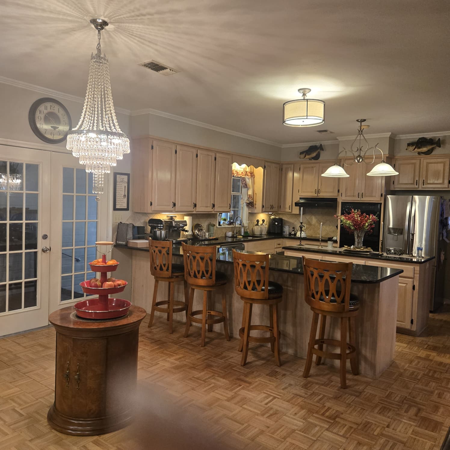 white wooden kitchen cabinet with black pendant lamp
