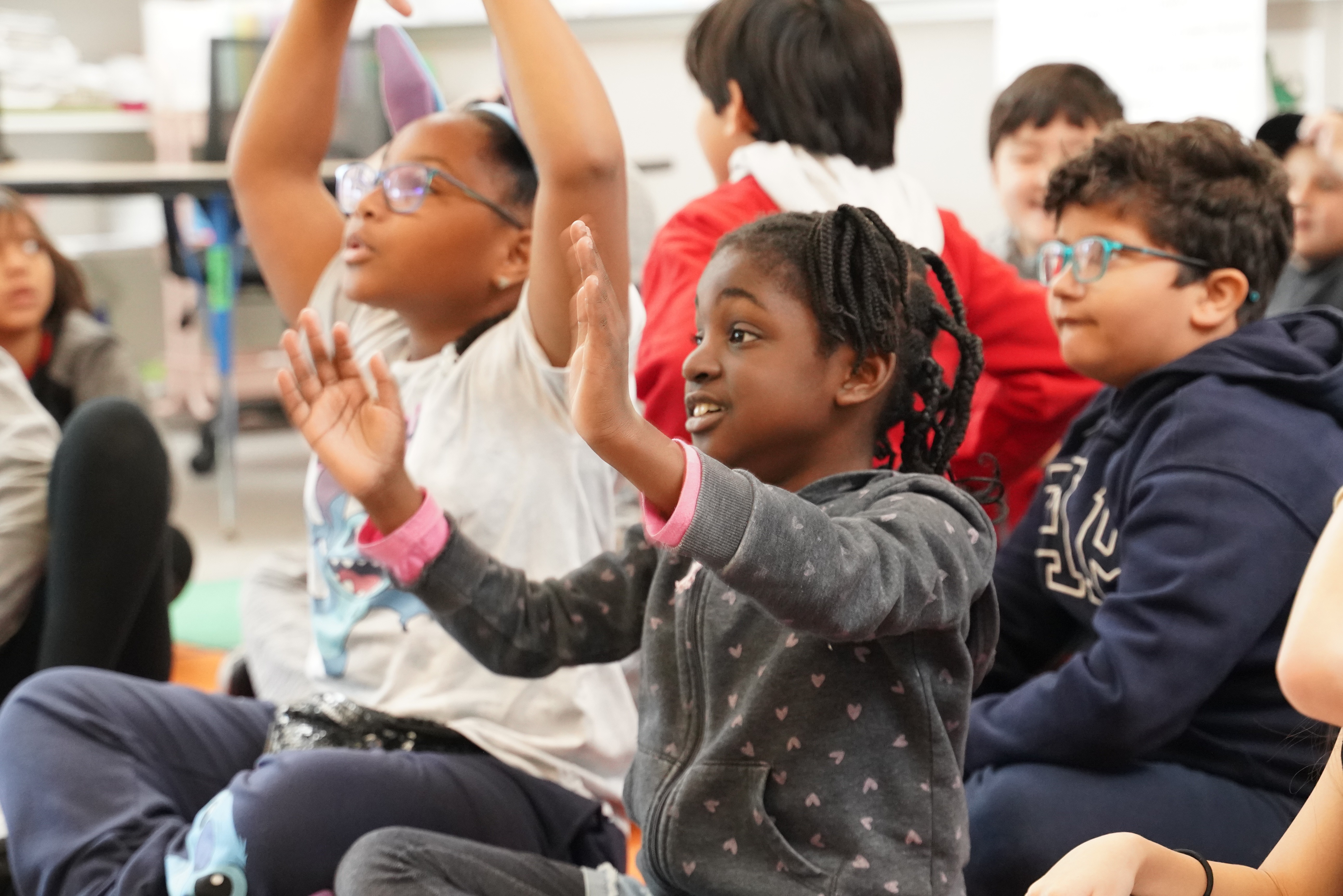 Students participating in a social-emotional learning activity during HOKALI aftercare program.