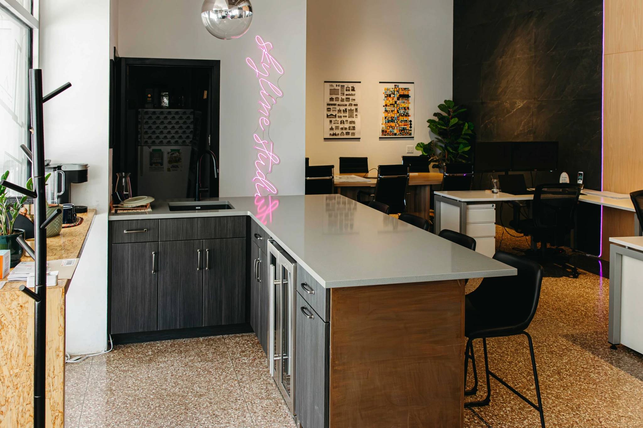 Skyline office in Saskatoon with the kitchen area visible showcasing a custom coutnertop and copper bar