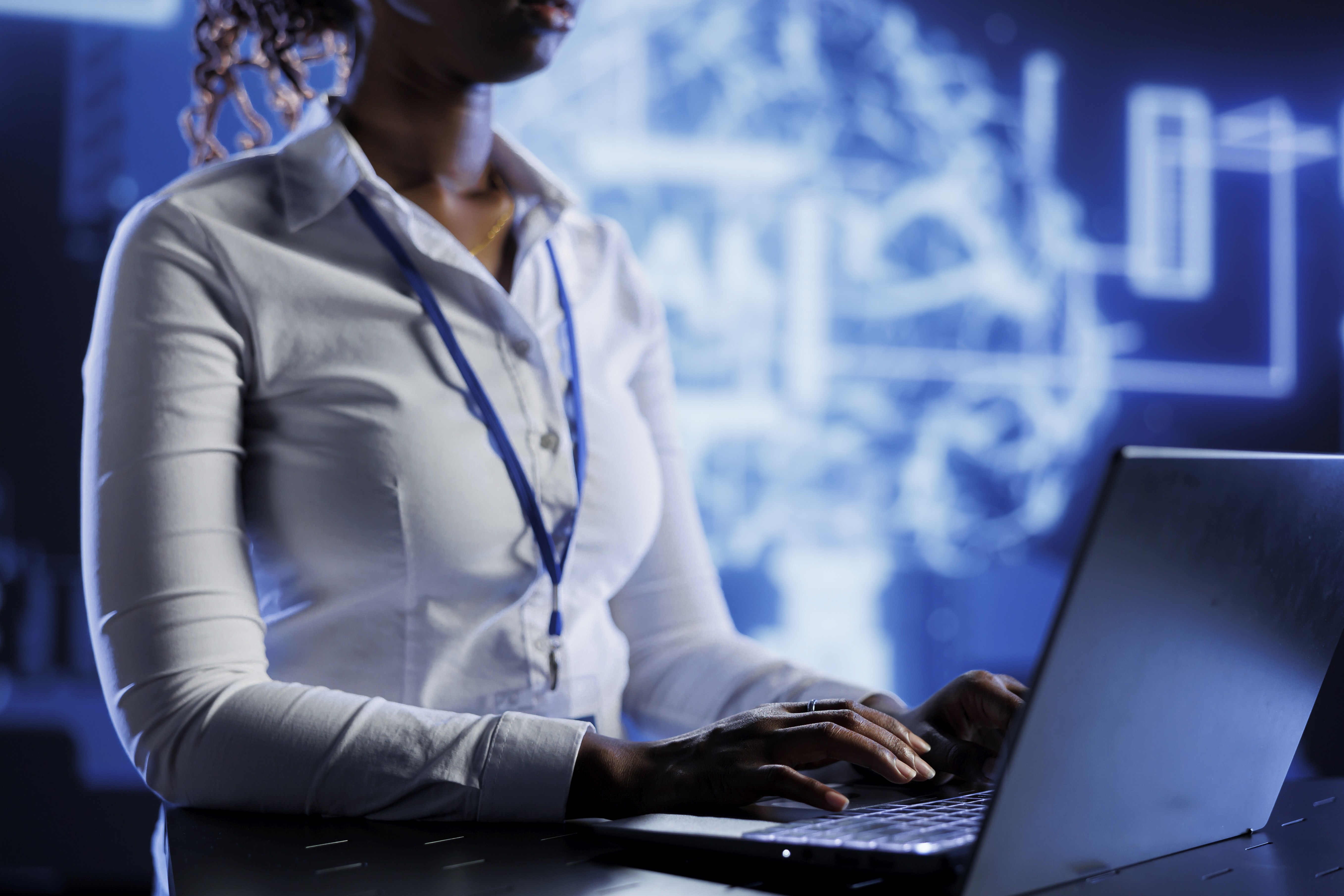 Man wearing yellow sweater and white VR headset indoors