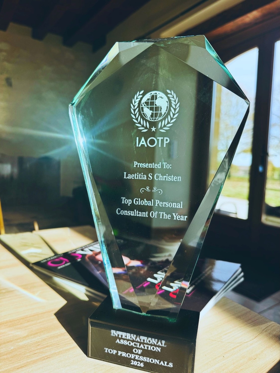 Crystal IAOTP award honoring Laetitia S. Christen as Top Global Personal Consultant of the Year 2026.