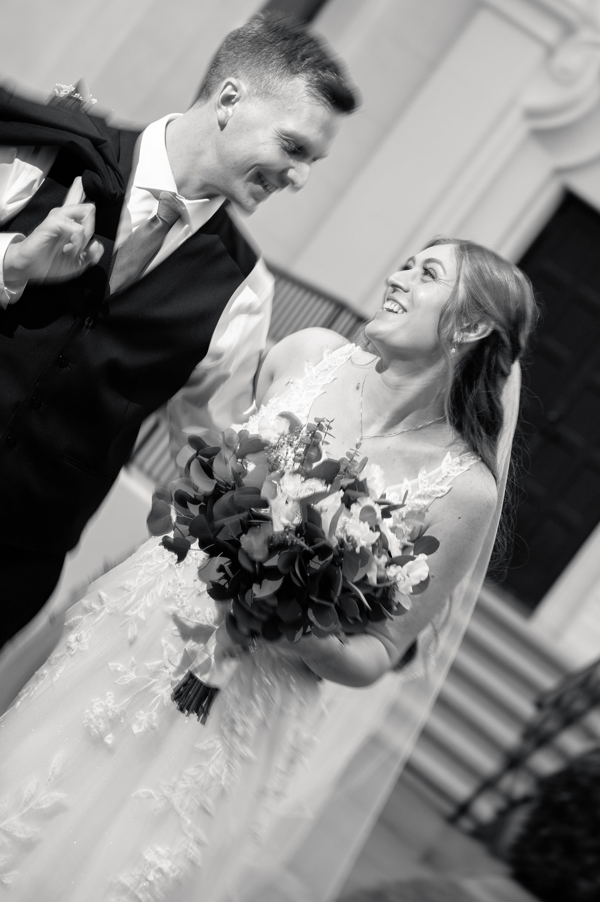 Flat lay wedding details with bouquet, rings, and sparkling bridal heels