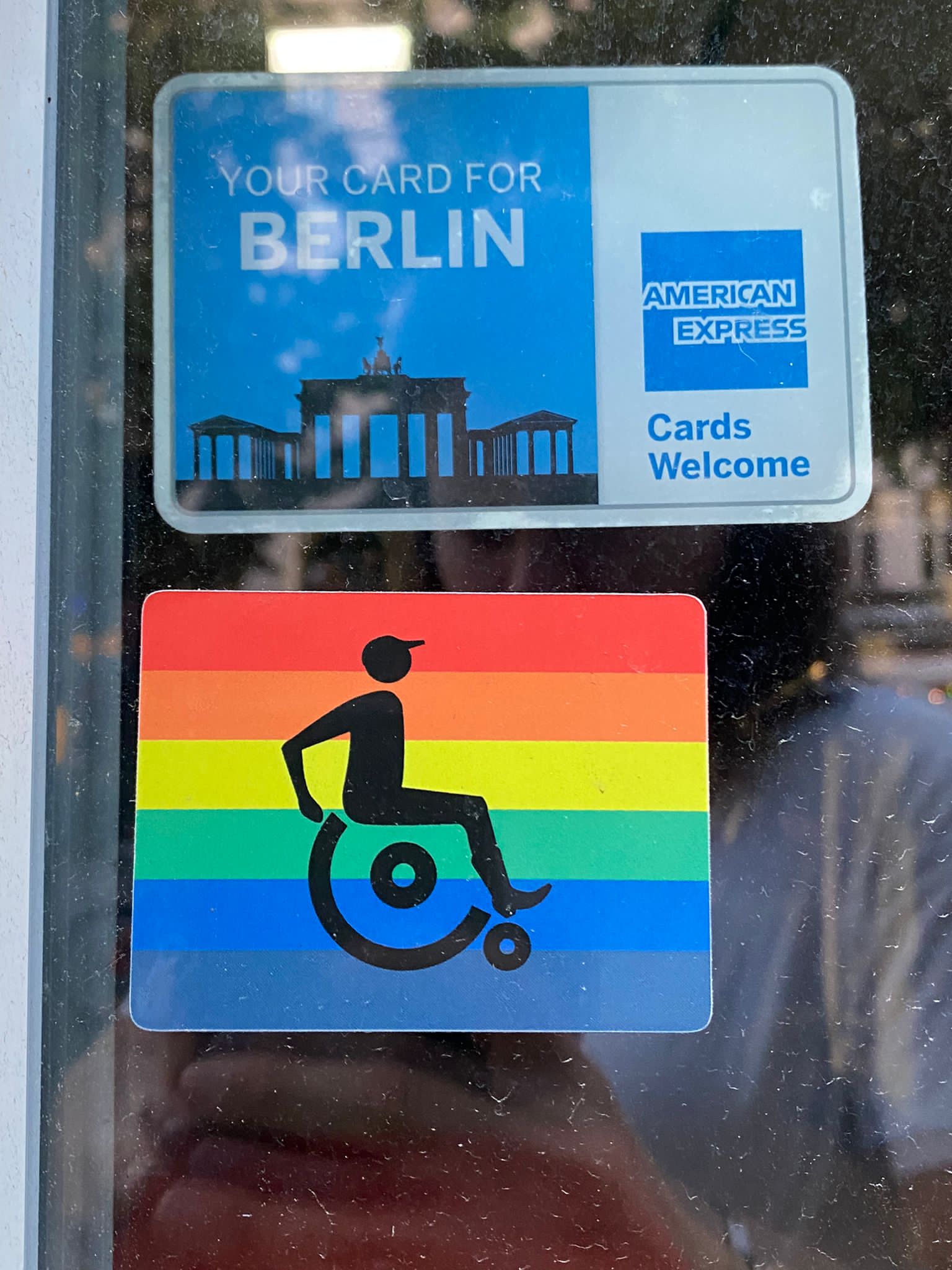 a brown dog sitting on top of a sandy beach