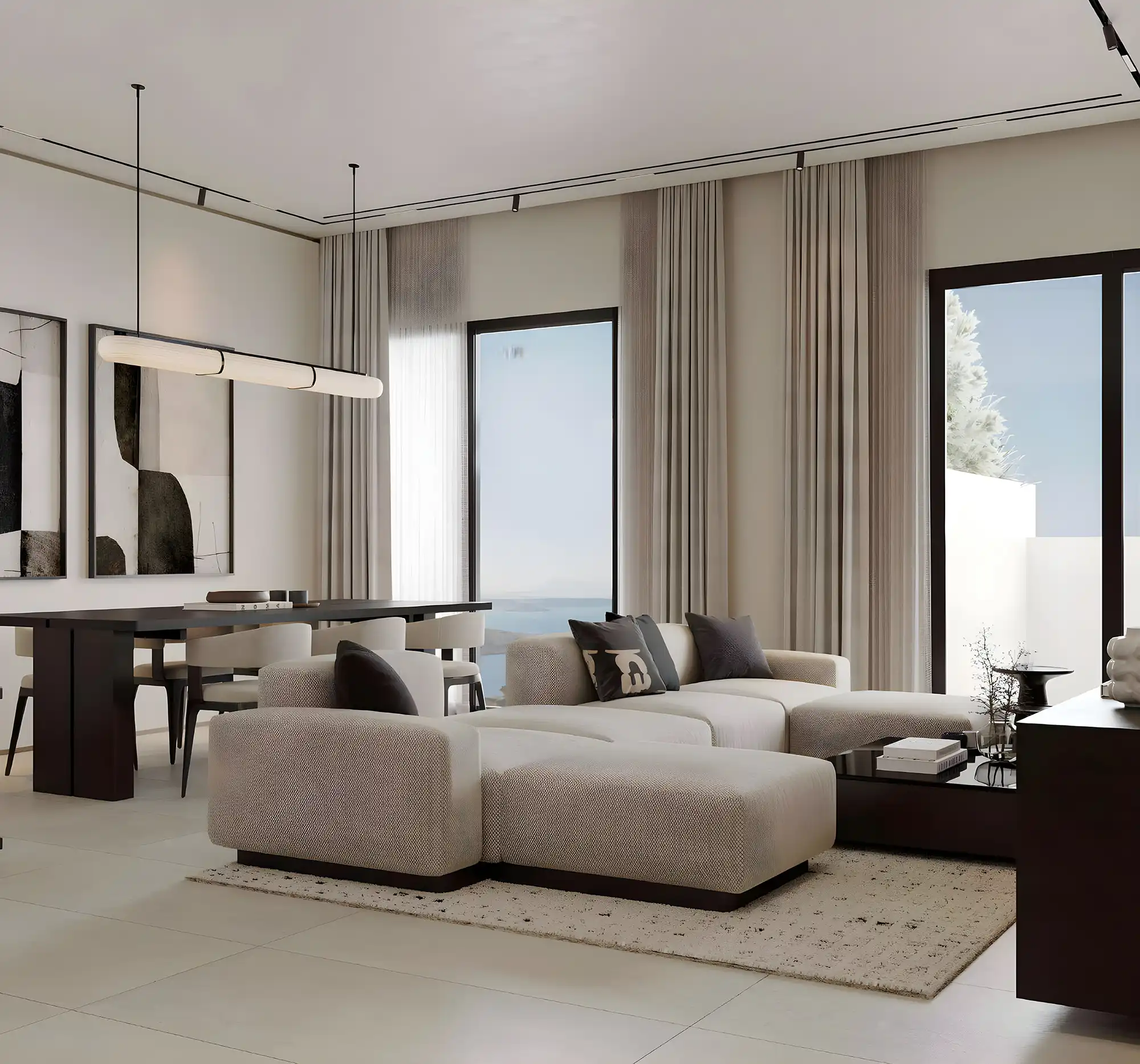 A stylish office area with a round table and seating, located within Marea Residences.