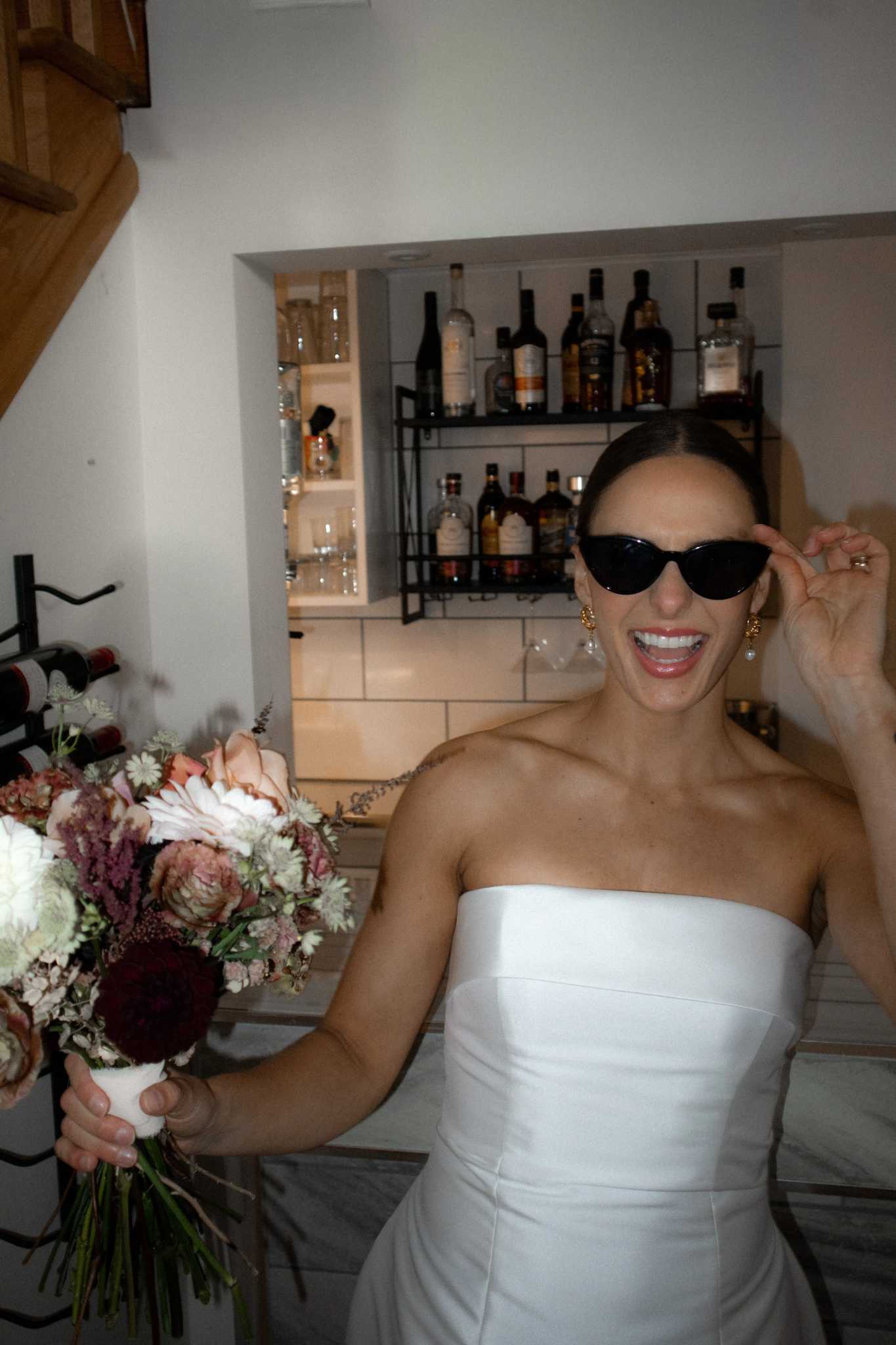 Bride celebrating at the cocktail bar inside Ashlar Ottawa