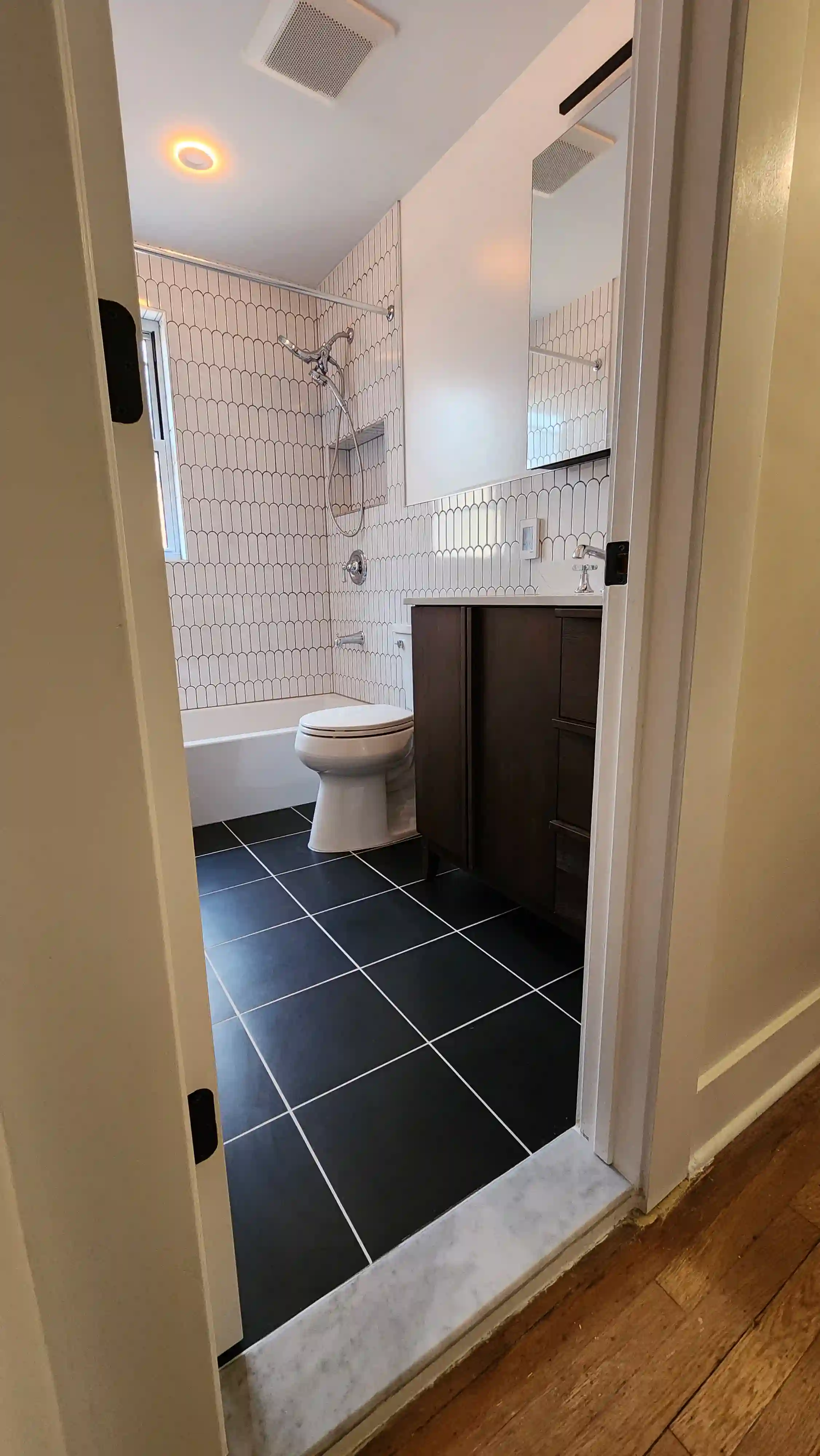 Trex composite deck stairs with picture framing, recessed lighting, and Transcend railings in Queens, NYC