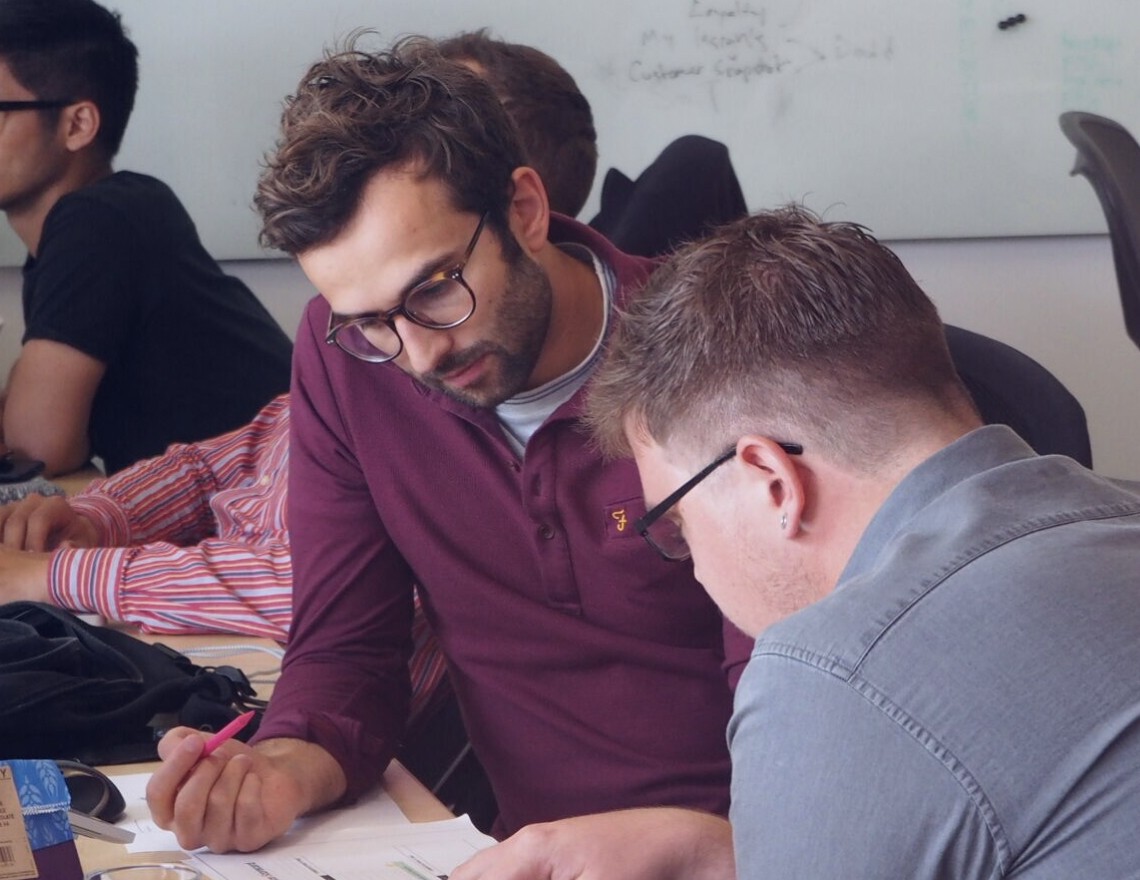 Tom and colleague Anders working in office