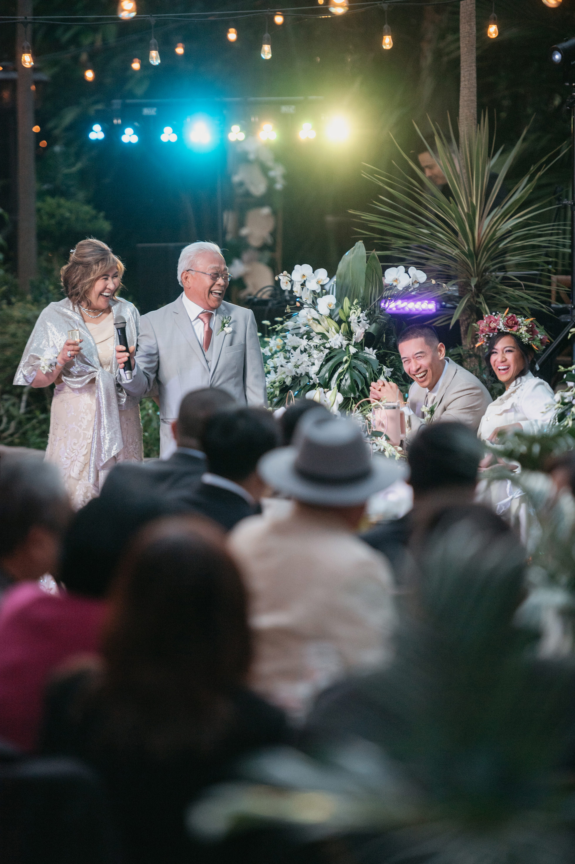 Flat lay wedding details with bouquet, rings, and sparkling bridal heels