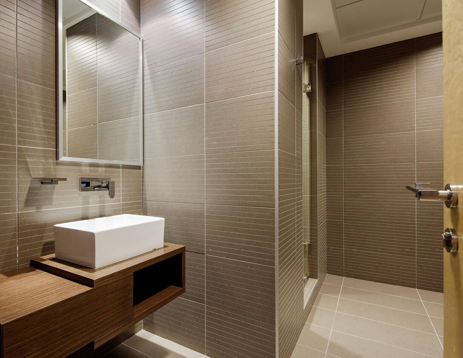 High-end bathroom finishes in a Rolex Tower unit, showcasing the quality of luxury real estate interiors.