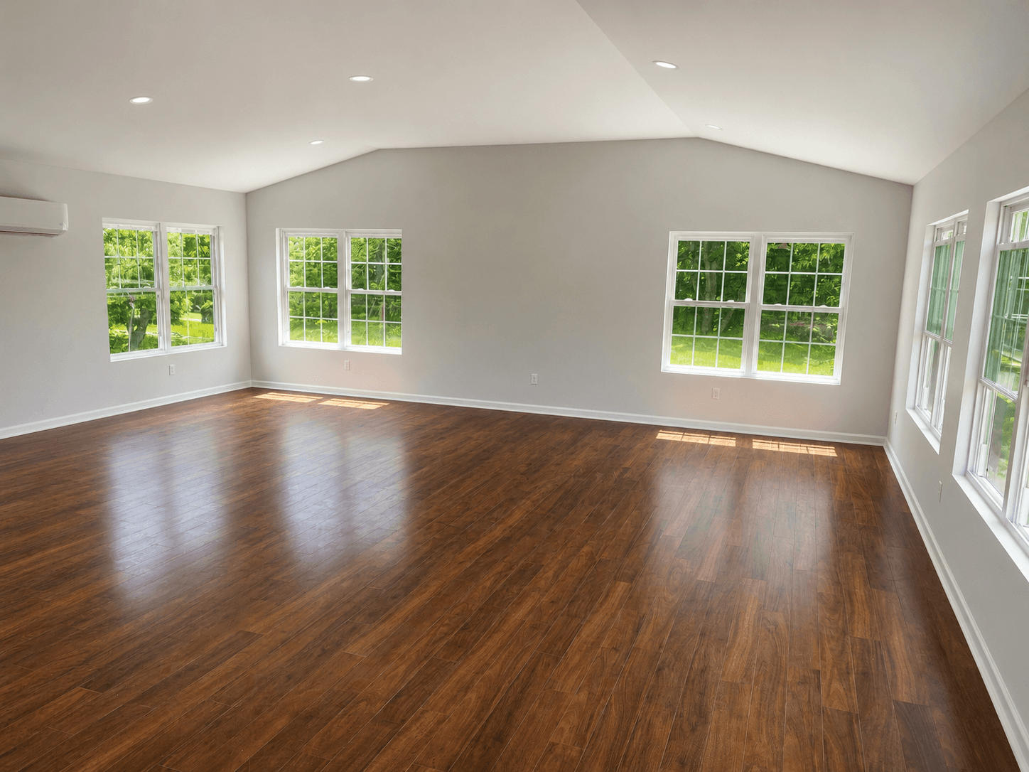 Finished interior of a custom home addition with recessed lighting, flooring, and completed living space in Mount Airy NC.