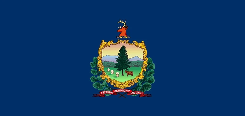 Flag of Vermont featuring a blue field with an ornate, central crest. It shows a pine tree, cows, and mountains, symbolizing nature and unity.